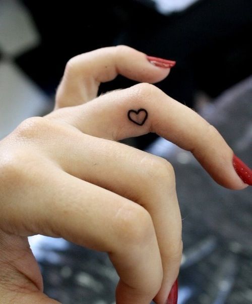 Cute tiny heart finger tattoo