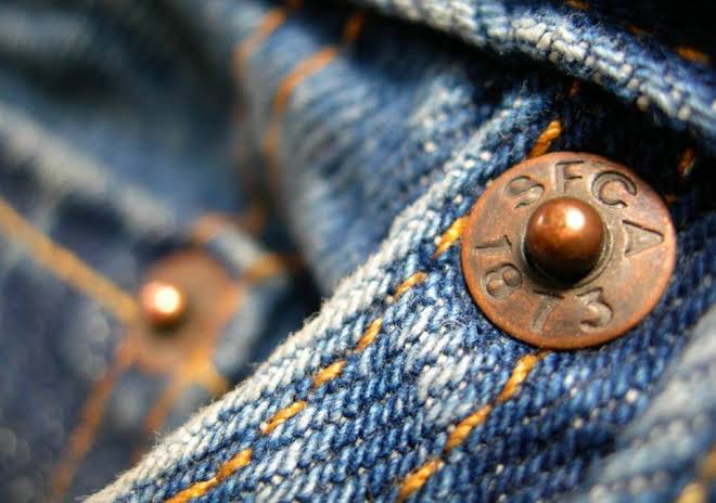 Why tiny round buttons have jeans pockets